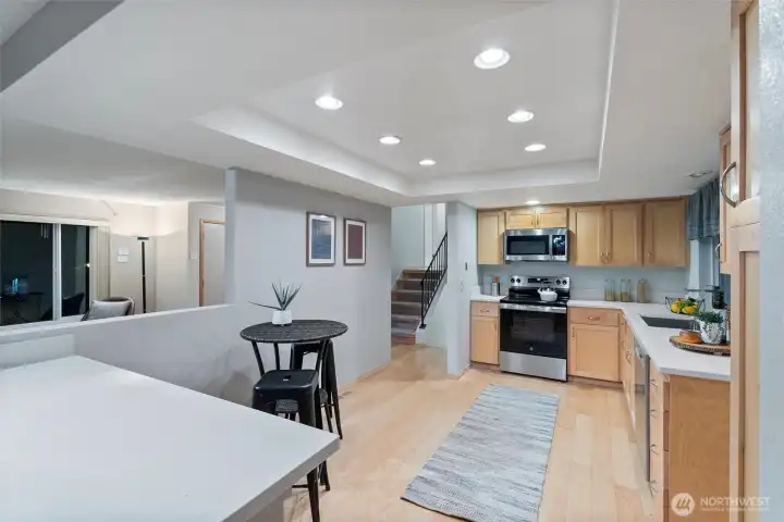 Bright kitchen with easy flow to nearby living spaces and a cozy spot for casual seating.