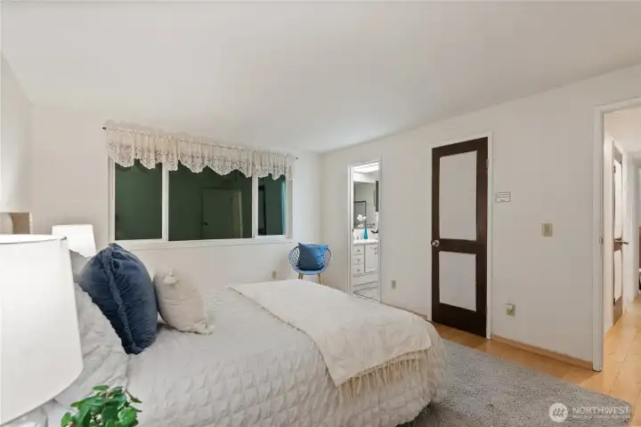 This spacious primary suite offers a peaceful setting to unwind, with direct access to the ensuite bath and a walk-in closet for added convenience.