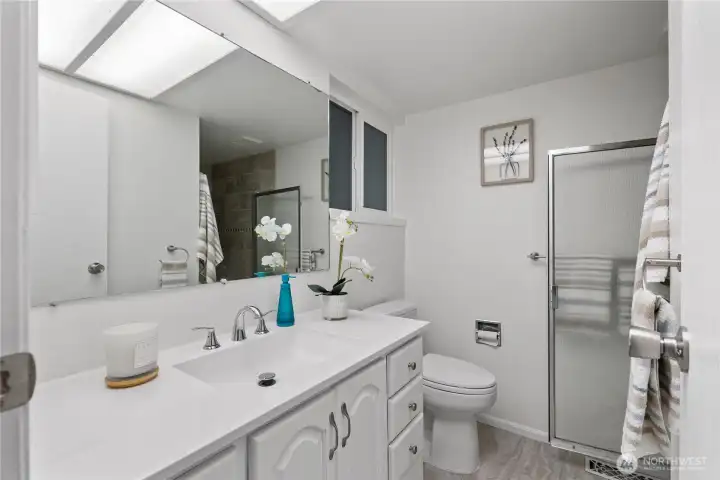 Enjoy the comfort of your own private ensuite bath, offering generous counter space and a light, relaxing setting.