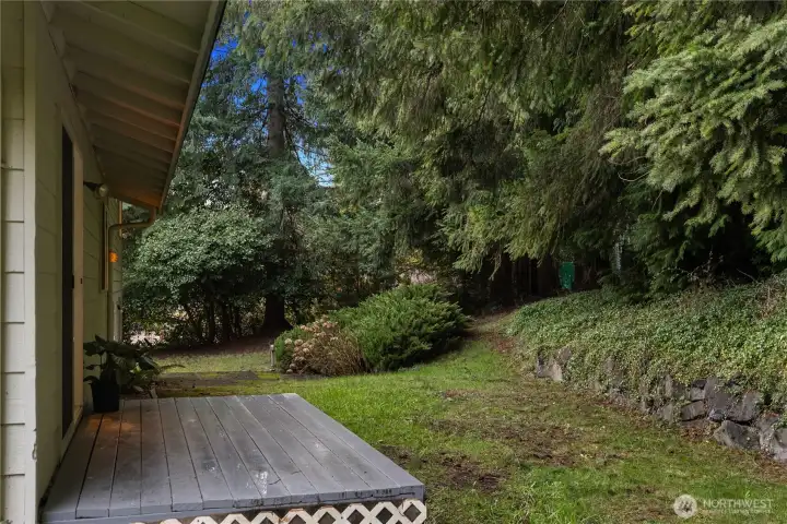 Surrounded by nature, this spacious yard invites you to create your own outdoor sanctuary.