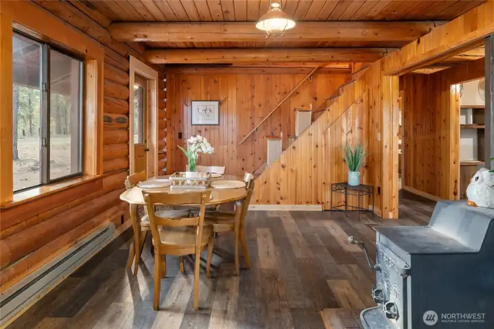 Staircase off the entry and dining room leads to the upper level.