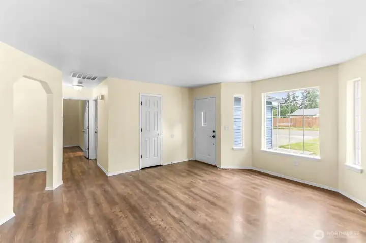 Dining room on left, hallway to Primary, primary bath, laundry and garage