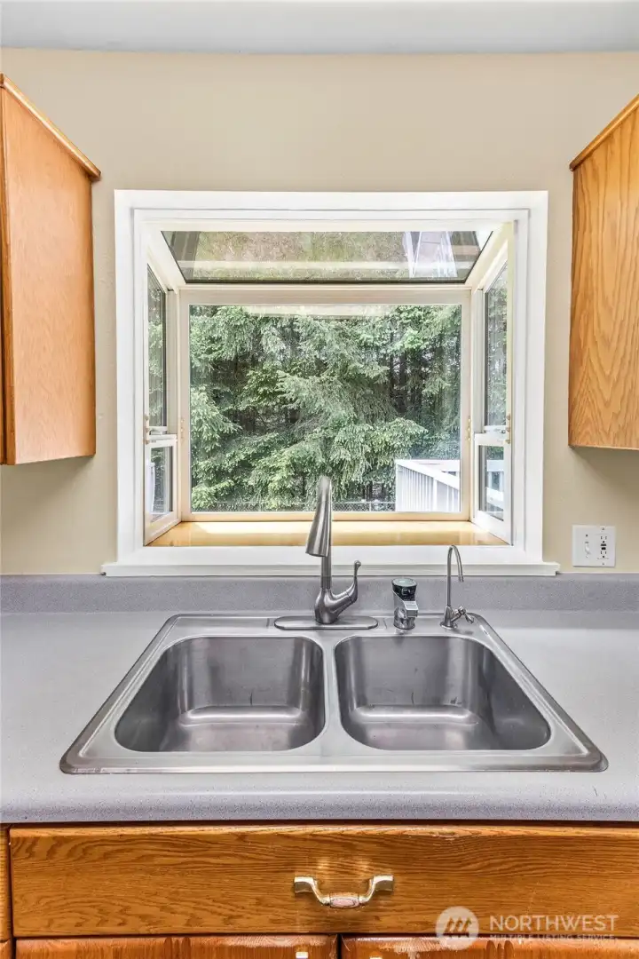 Bay window above sink for natural light in the kitchen