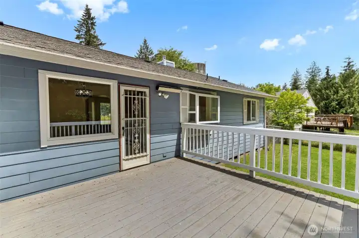 Back of home with large deck for entertaining