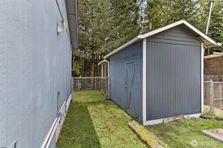 RV hookup, storage shed, fenced, grass has been enhanced