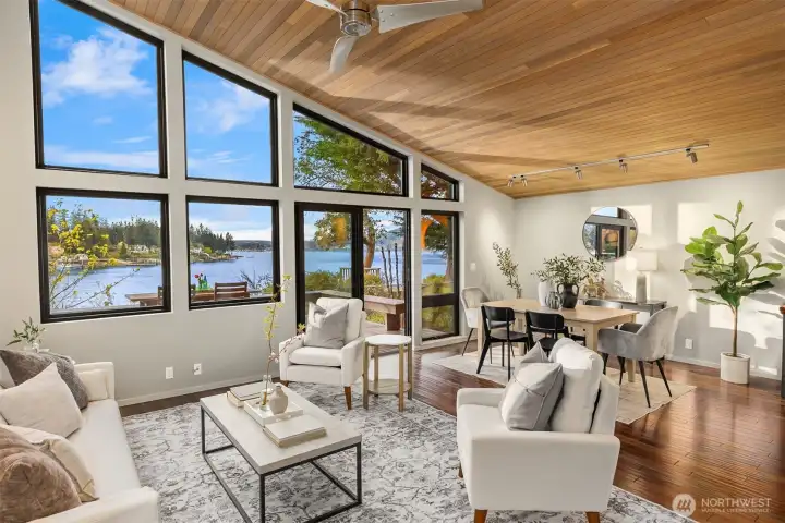 A wall of windows and vaulted wood ceilings make a stunning first impression.