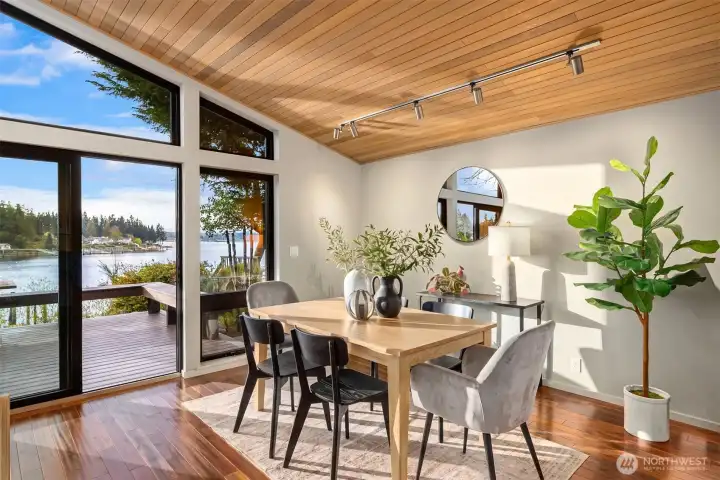 Inviting dining area adjacent to the kitchen, offering peaceful views and easy access to outdoor living.