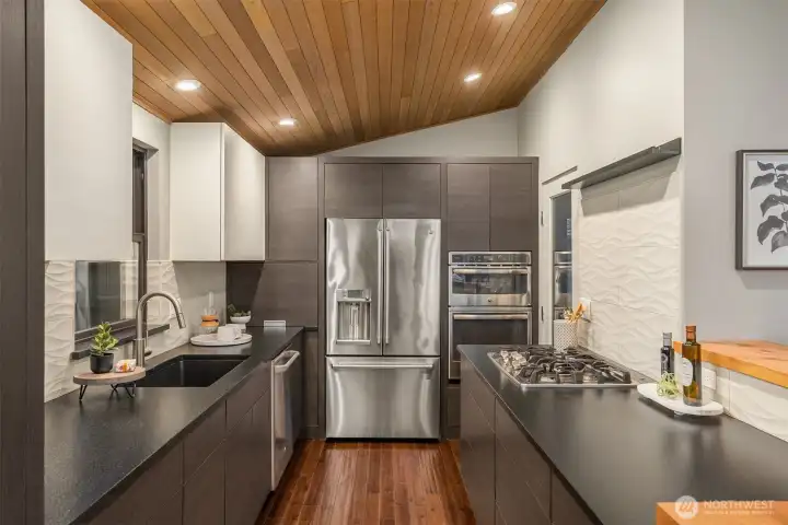 Nice counter space and clean lines in this professionally designed modern kitchen.
