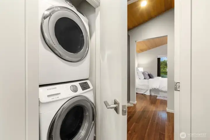 The concealed laundry closet within the primary suite.