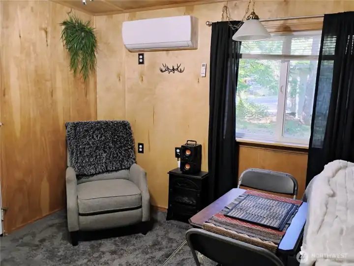 Imagine yourself relaxing with a board game or puzzle in this cozy space