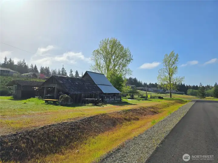 Beautiful old farmstead as you drive into The Ranch at LakeLand Village