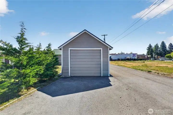 Detached single garage with paved parking and alley access Detached single garage with paved parking and alley access
