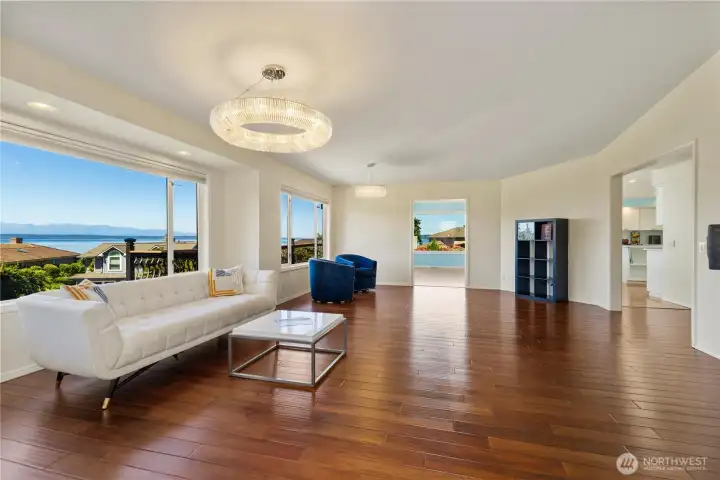 Expansive, sun lite living room with massive SW views