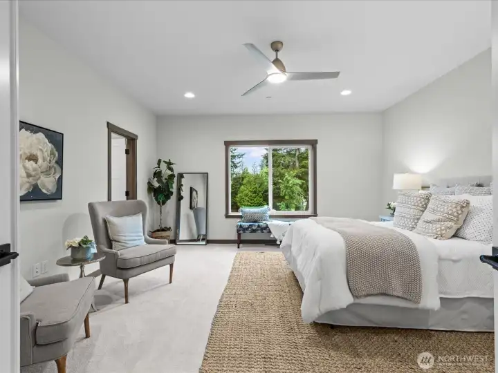 Generous primary bedroom suite showcasing a bright, airy layout with large windows that flood the space with natural light.