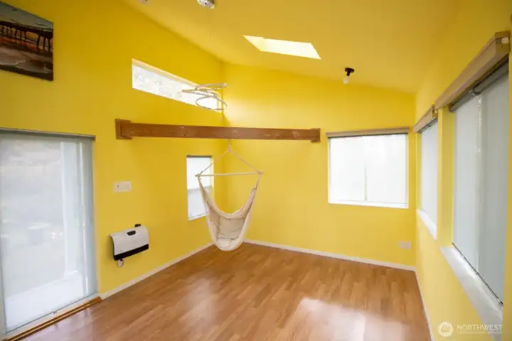 Versatile studio is wired with power and internet, has a skylight, sliding-glass door, and wall heater for year-round comfort. Versatile studio is wired with power and internet, has a skylight, sliding-glass door, and wall heater for year-round comfort.