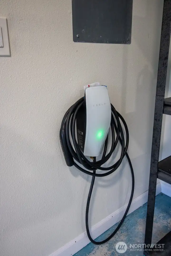 Convenient in-garage EV charger for easy home charging. Convenient in-garage EV charger for easy home charging.