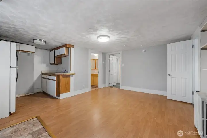 basement - view of a kitchenette and a living area space. Vantage point is from the exterior door that opens from the front of the house. basement - view of a kitchenette and a living area space. Vantage point is from the exterior door that opens from the front of the house.
