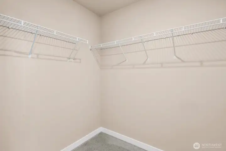 Primary walk-in closet Primary walk-in closet