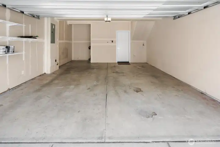 Attached two-car garage with space for storage Attached two-car garage with space for storage