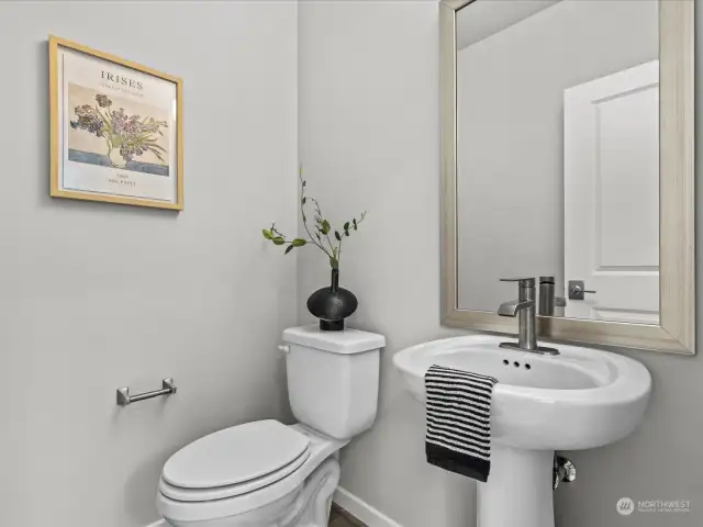 Powder room in between the dining and living room.