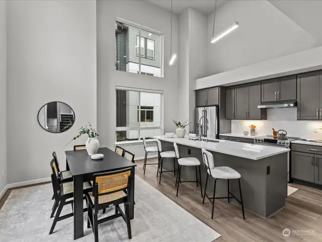 Large kitchen island bar featuring touch-less sink and hidden microwave.