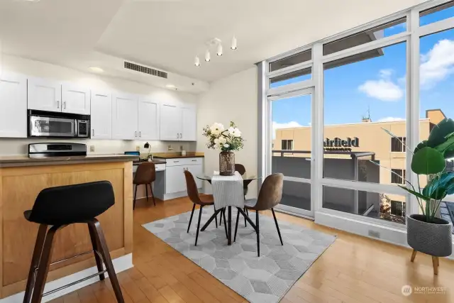 The dining area is large enough for a formal table.  A second covered balcony can be accessed off the dining and kitchen area; perfect for letting in some fresh air or to have your first cup of Joe in the morning.