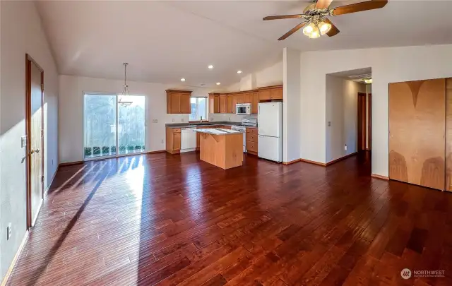 Large living room and kitchen with engineered wood floors