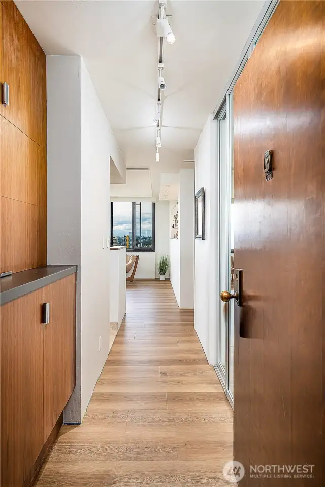 Entry has custom cabinetry pictured & large closet on the right.