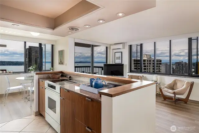 Kitchen remodel removed wall creating a modern, open floor plan