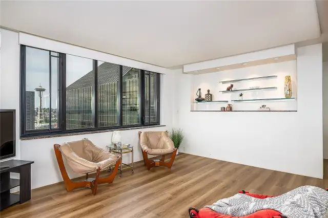 Nook on living room wall with glass shelves.  New LVP ordered for entry, living and dining area.
