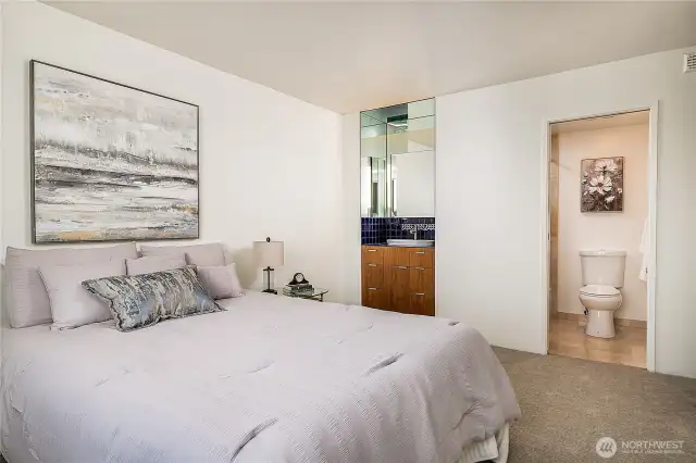 Primary suite has a  "continental bath" (Vanity in the room, shower/toilet separate)