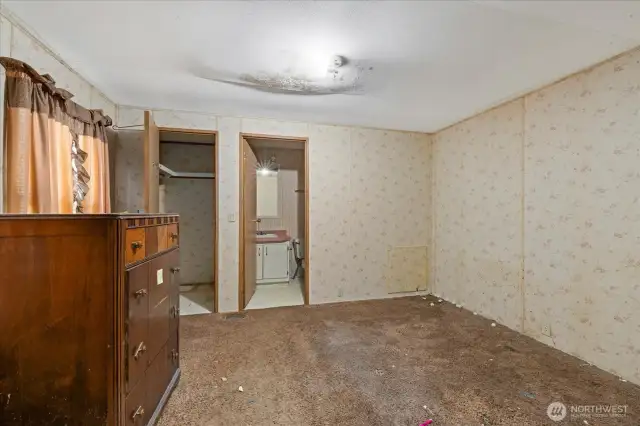 Primary bedroom and full bathroom walk-in closet