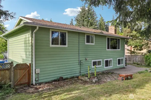 Spacious backyard for gardens, entertainment, & more; recently mowed.