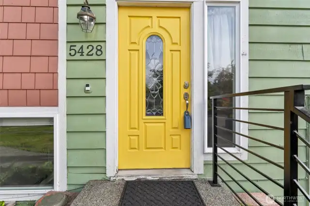 Brightly painted door makes this a happy entry-way