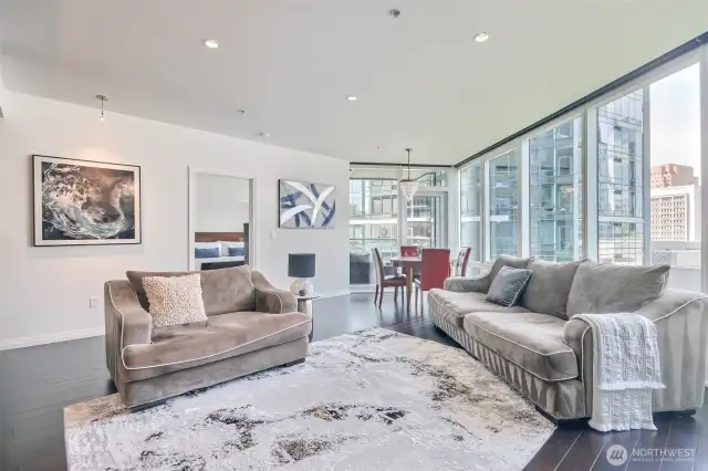 Large living room with floor to ceiling windows
