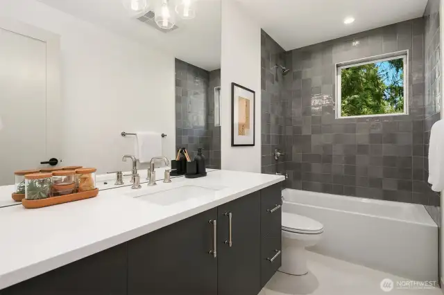 Guest Bathroom with Drop-in Tub, Tile Surround and Floating Vanity
