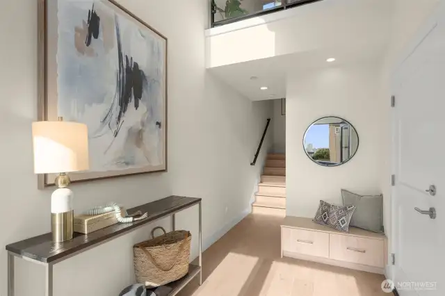 Step into elegance—light-filled entryway with stylish detailing sets the tone for the refined living experience ahead.