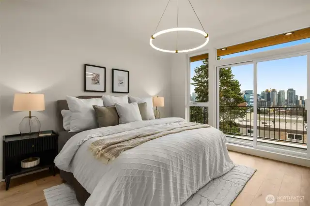Unwind in your sun-drenched primary suite, thoughtfully positioned for ultimate privacy and comfort. The room flows seamlessly into a custom walk-in closet with built-ins, and an en-suite spa-inspired 5-piece bathroom, making this a true sanctuary within the home.