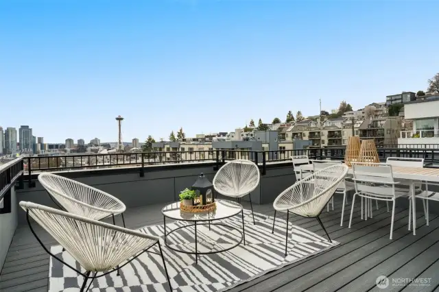 Stunning rooftop deck with sweeping views of the Seattle skyline and Elliott Bay.