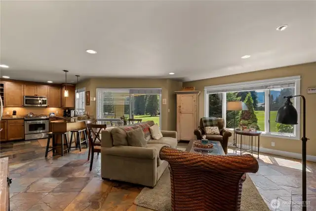 Living room, dining room, patio, and kitchen
