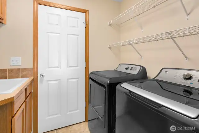 Utility room with cabinets and sink.