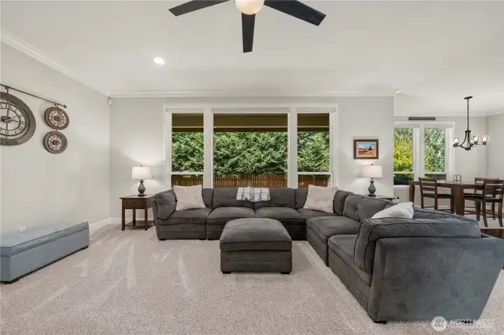 Expansive windows fill the family room with natural light and provide a seamless indoor-outdoor connection.