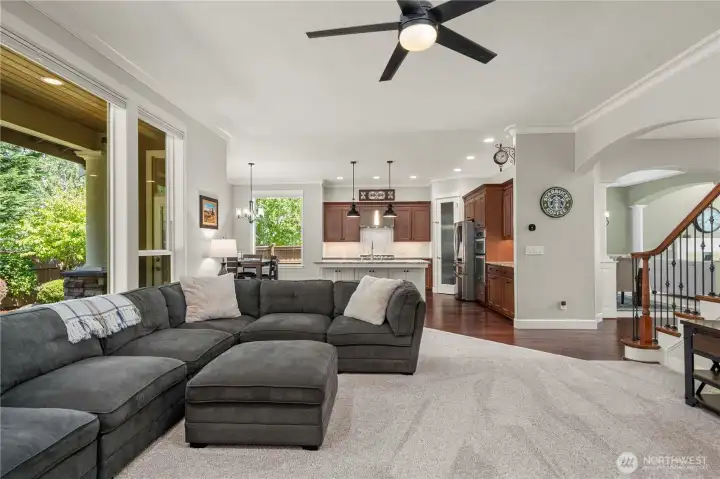 Open-concept family room flows into the gourmet kitchen, creating an ideal layout for gatherings.