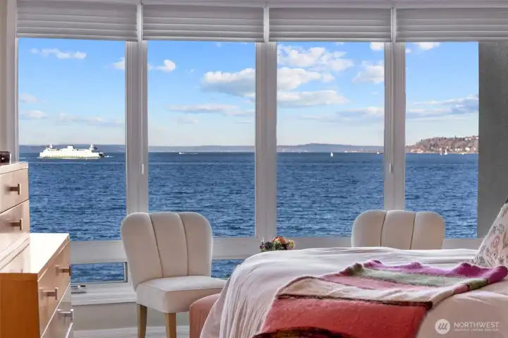Moving into the Primary Suite, you’ll be greeted by nearly floor-to-ceiling windows that frame breathtaking views of the Olympic Mountains and Puget Sound, with the ever-moving Ferries adding a dynamic touch to the scenery. Imagine waking up each day to this stunning panorama!