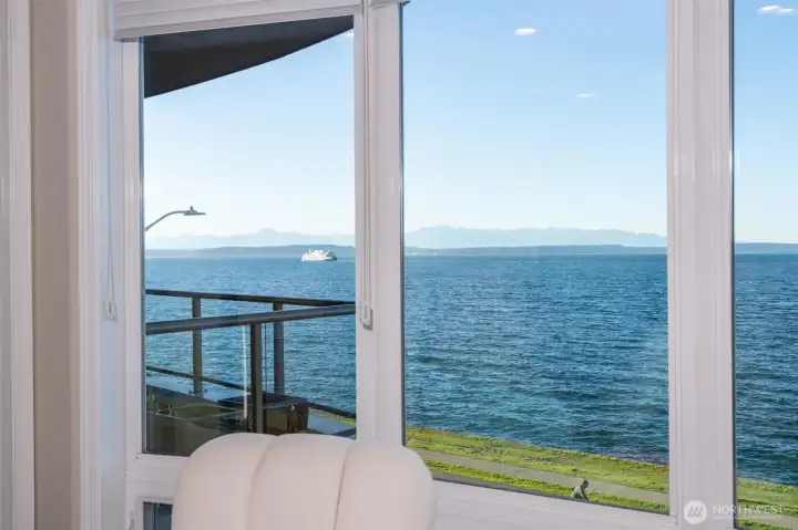 View facing Primary opens onto the snowcapped Olympic Mountains, offering a serene and breathtaking panorama. The crisp, white peaks contrast beautifully against the sky, creating a tranquil and inspiring backdrop visible right from the comfort of the suite.