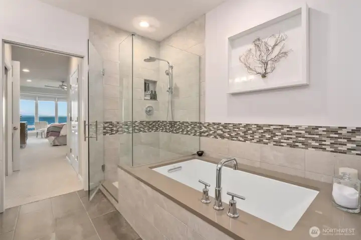 The relaxing soaking tub and separate shower provide versatile options for your morning routine.
