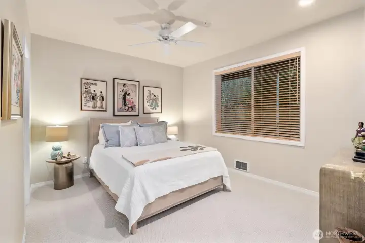 Peaceful guest bedroom with walk-in closet.