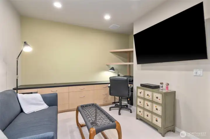 The versatile home office is presently configured as a media room.