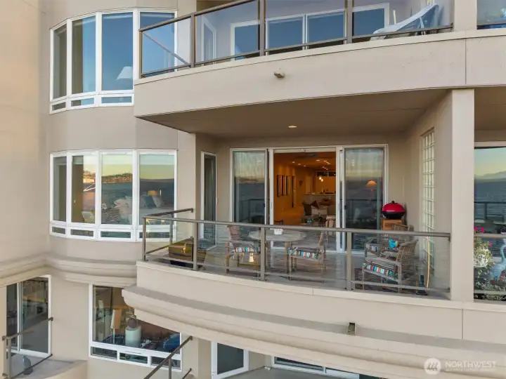 The spacious view lanai is accessible through double glass doors in the living room and also from the view-facing Primary Suite.