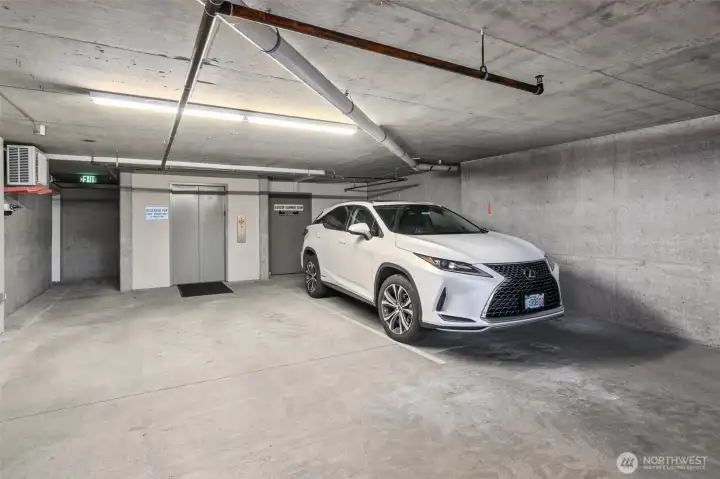 The second parking spot is right next to the elevator for EASILY taking groceries and other items upstairs.